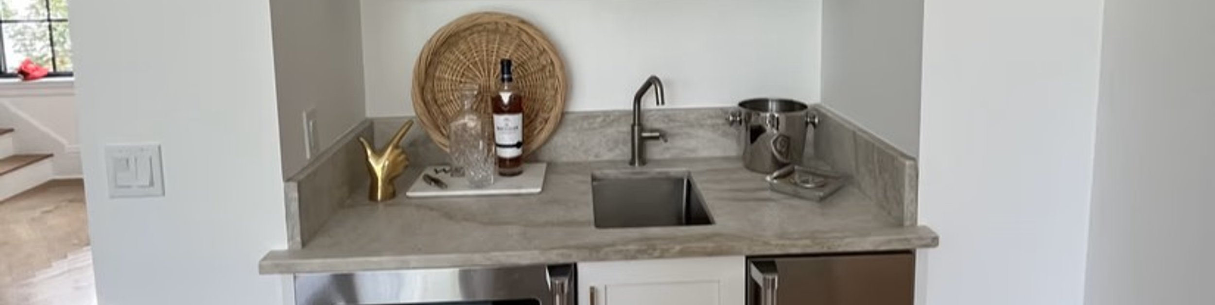 Wet bar with freshly painted cabinetry