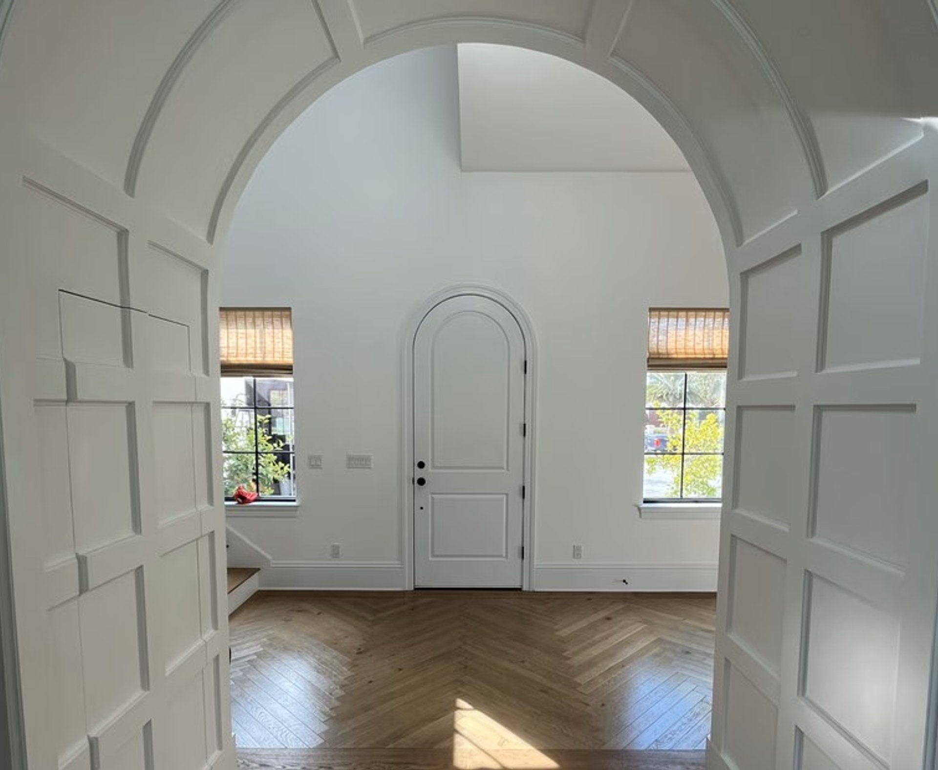 Arched entryway with painted paneling
