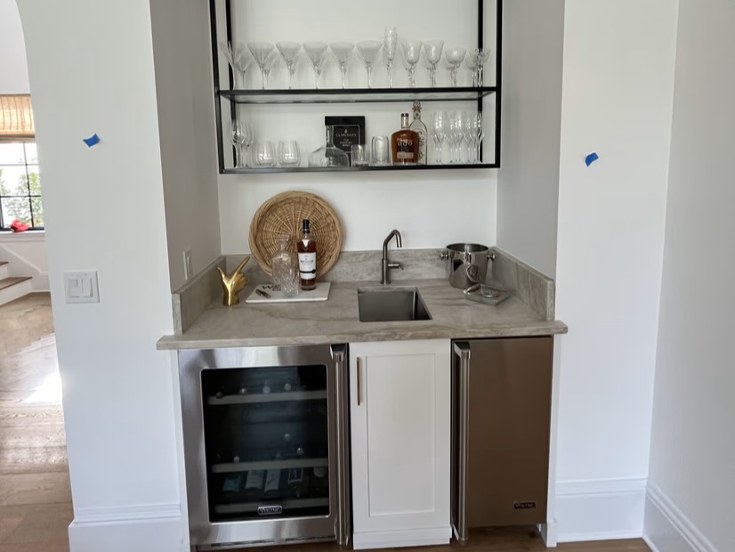 Wet bar with freshly painted cabinetry